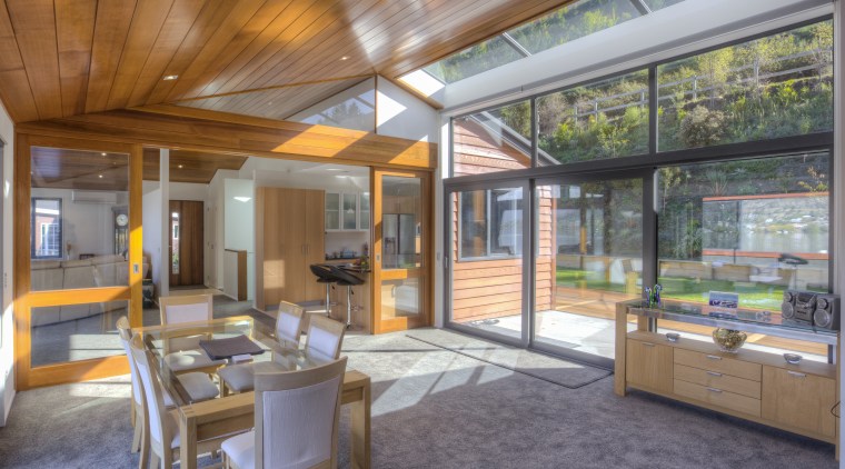 The upper main living level offers plenty of architecture, home, house, interior design, real estate, roof, window, gray, brown