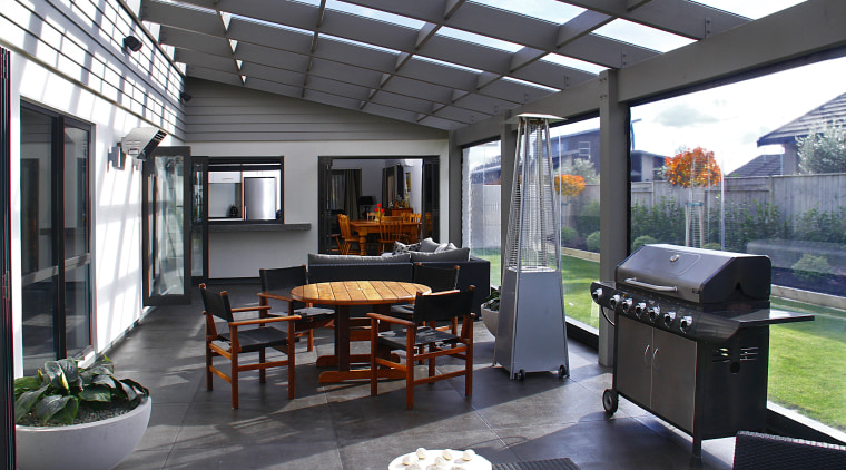 An all-weather outdoor space is the social hub interior design, outdoor structure, patio, real estate, gray, black