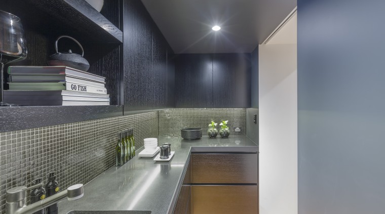 This scullery can be screened from view by architecture, countertop, interior design, kitchen, gray, black