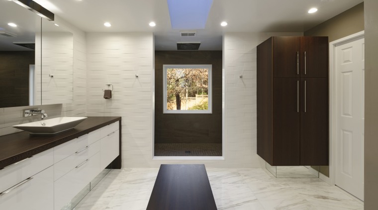 A skylight and indirect lighting from three sconces cabinetry, countertop, floor, flooring, interior design, kitchen, room, wood flooring, gray