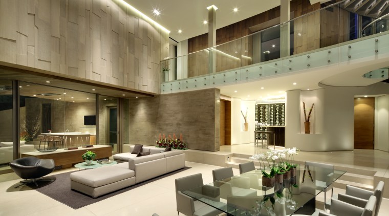 This hillside home is an entertainers dream. Guests architecture, ceiling, condominium, interior design, living room, lobby, real estate, brown