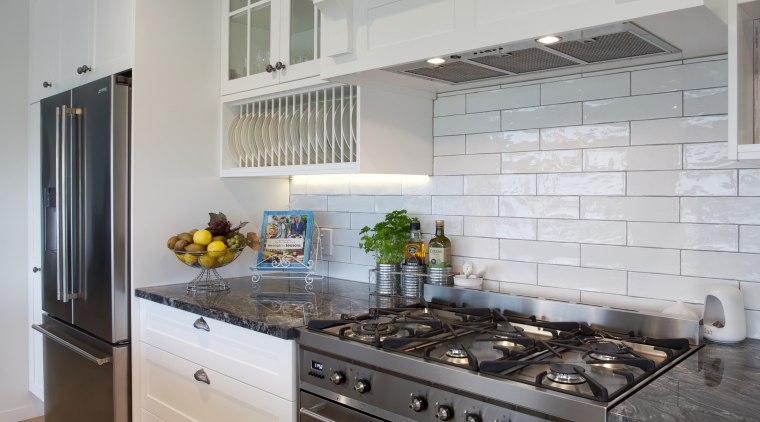 Open, breezy and welcoming, this kitchen designed by cabinetry, countertop, cuisine classique, floor, home, home appliance, interior design, kitchen, kitchen appliance, kitchen stove, room, gray
