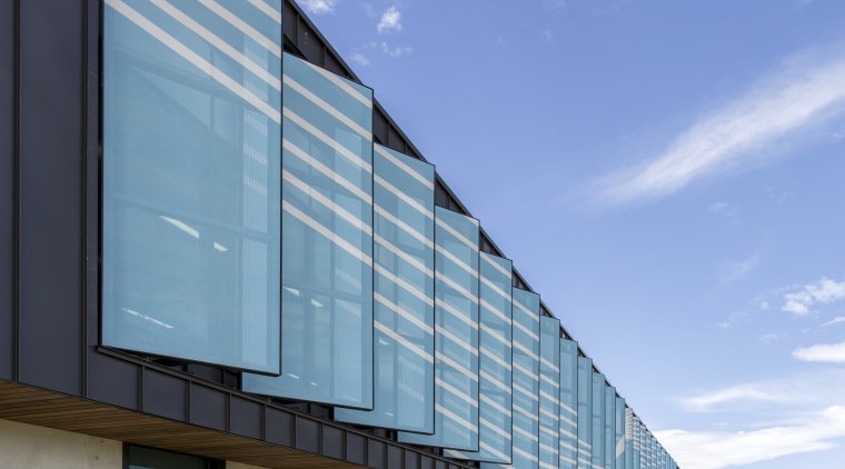 Custom shade screens on Synlaits new administration building architecture, building, commercial building, corporate headquarters, daytime, facade, headquarters, house, sky, teal