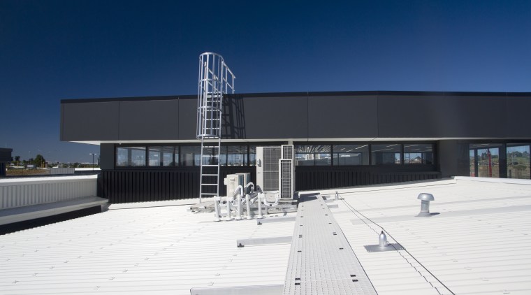 The safety systems on NorthWest Shopping Centre are architecture, building, corporate headquarters, daytime, facade, roof, sky, structure, blue, white