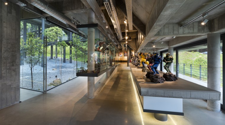 An independent L-shaped concrete structure contains a cinema architecture, tourist attraction, black, gray
