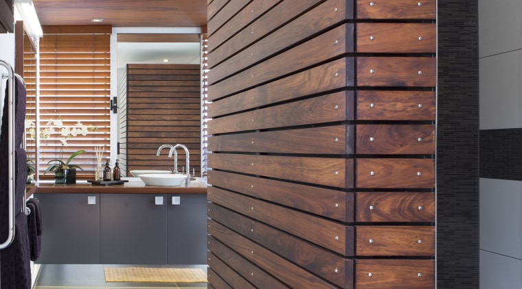 On this bathroom renovation, the black external wall architecture, daylighting, facade, floor, flooring, furniture, hardwood, interior design, wall, wood, wood stain, red