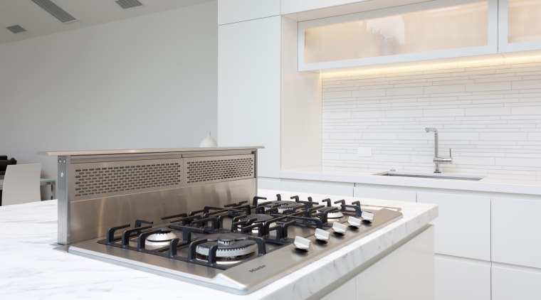 A discreet, pop-up Wolf downdraft extractor allows this countertop, interior design, kitchen, product design, white, gray