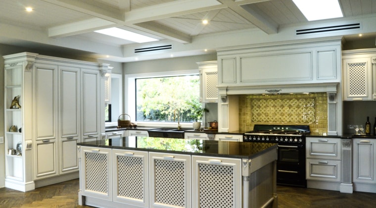 In this kitchen, the tongue & groove treatment cabinetry, ceiling, countertop, cuisine classique, floor, flooring, interior design, kitchen, room, wood flooring, gray, brown