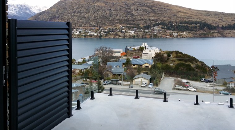 Privacy screens between decks on this projectwere property, real estate, roof, sea, sky, town, gray, black
