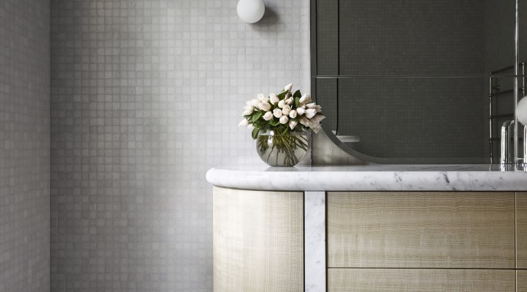 Carrara marble was used for the smooth, rounded bathroom, bathroom accessory, bathroom cabinet, ceramic, floor, flooring, furniture, interior design, product design, tap, tile, wall, gray, black