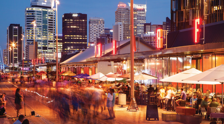 Residents at Wynyard Quarter have access to a city, cityscape, downtown, evening, metropolis, metropolitan area, mixed use, night, sky, skyline, skyscraper, town, urban area, red