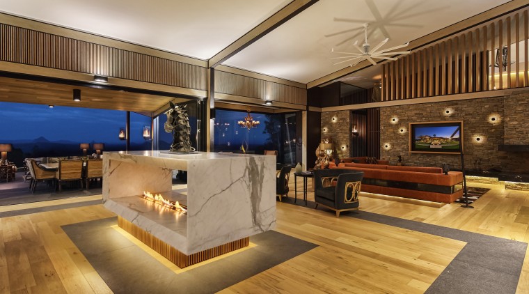 Kinetic sculpture this fireplace can be turned floor, flooring, interior design, real estate, wood, orange, brown