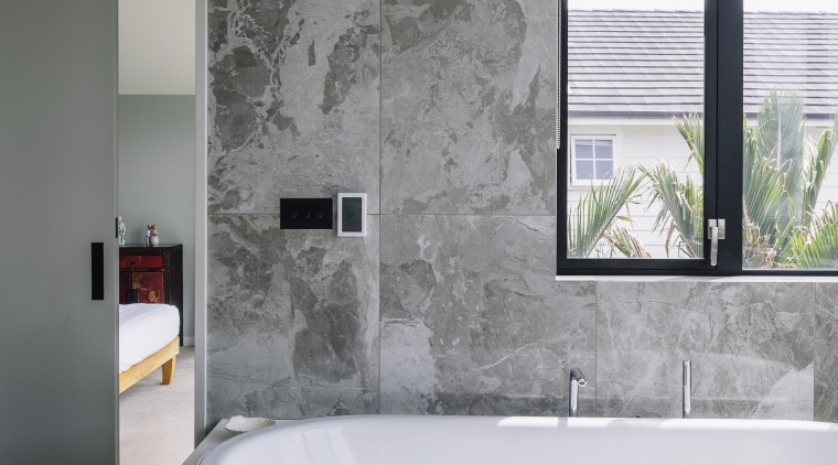 A floating vanity, toilet and bidet are teamed bathroom, bathtub, floor, glass, interior design, plumbing fixture, tap, gray
