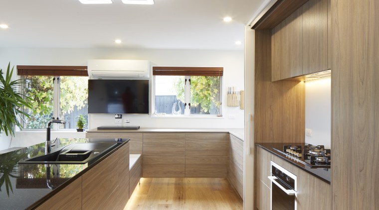 This glamorous contemporary kitchen was installed by Markov ceiling, countertop, daylighting, floor, flooring, hardwood, house, interior design, kitchen, laminate flooring, living room, real estate, wood, wood flooring, gray