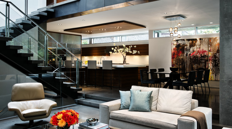 Although these interiors present as one large open interior design, living room, loft, black, gray