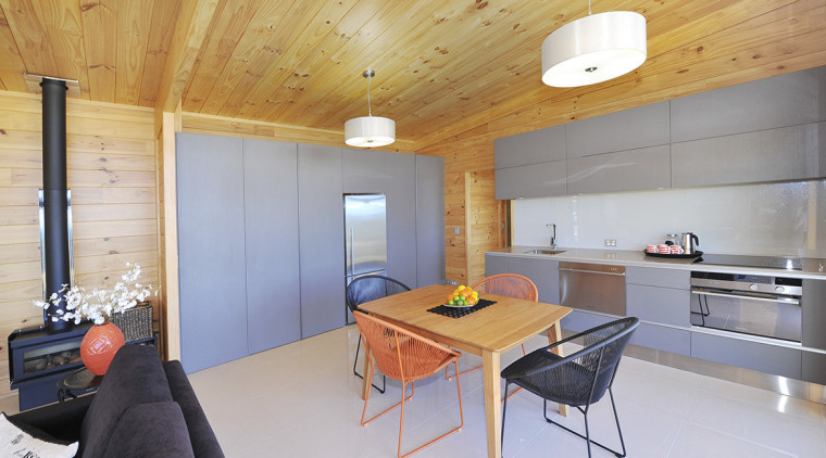 The Lockwood Papai kitchen has ample storage and architecture, ceiling, floor, house, interior design, loft, real estate, room, table, wood, gray, orange