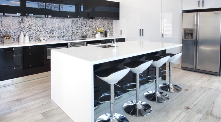 Crisp white Corian countertops and black high gloss countertop, floor, flooring, interior design, kitchen, product design, white