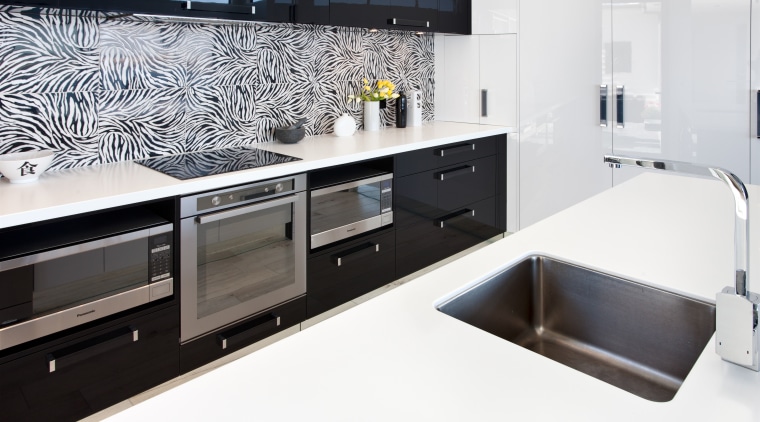 The tiles for this splashback were sourced in countertop, interior design, kitchen, product design, room, sink, white, black