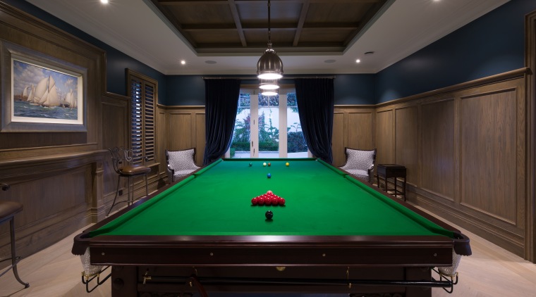Ornate panelling seen on the ceiling and walls billiard room, billiard table, blackball pool, carom billiards, cue sports, english billiards, games, indoor games and sports, pocket billiards, pool, recreation room, room, snooker, table, black