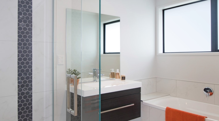 Modern and easy to clean, the main bathroom bathroom, bathroom accessory, bathroom cabinet, floor, interior design, plumbing fixture, product design, room, sink, gray