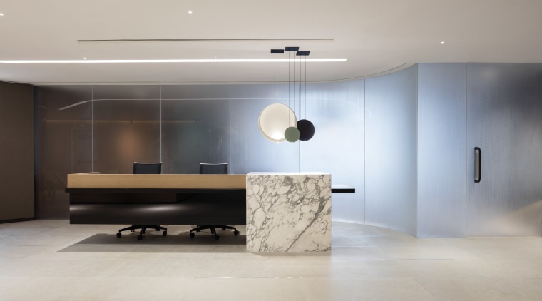 A dramatic cantilevered desk, designer lighting and a architecture, ceiling, floor, flooring, furniture, interior design, product design, wall, gray