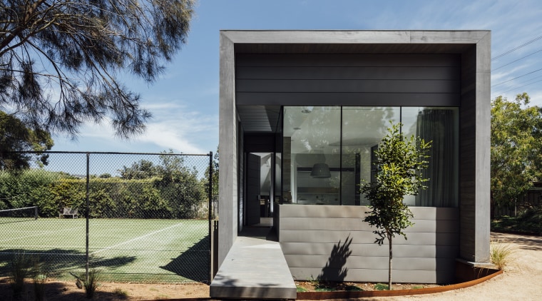 A small ramp leads up to this homes architecture, building, facade, home, house, real estate, black