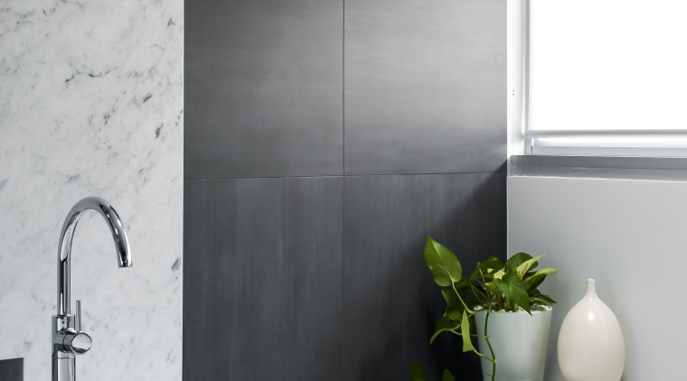 Floating the laundry hamper-cum-seating area along with the bathroom, black and white, ceramic, floor, flooring, home, interior design, plumbing fixture, product design, room, tap, tile, wall, gray