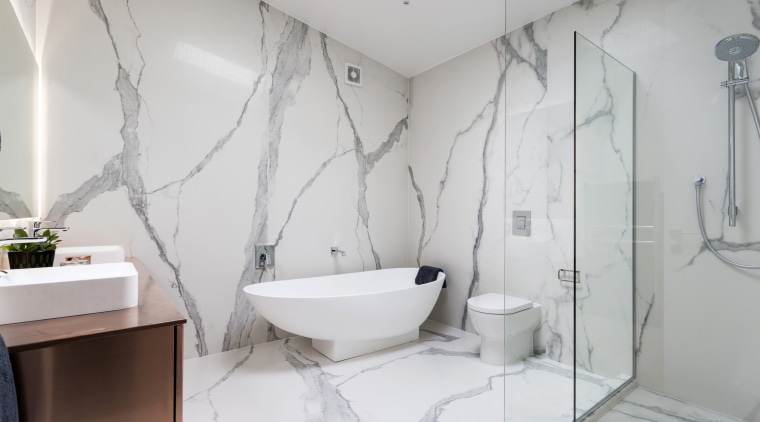 This copper-clad, wall-hung vanity was custom designed, with bathroom, floor, home, interior design, plumbing fixture, product design, property, room, tap, tile, wall, gray