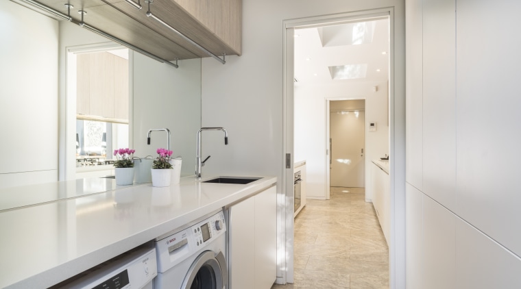 The generous bench space in this laundry is countertop, cuisine classique, floor, home appliance, interior design, kitchen, property, real estate, room, gray