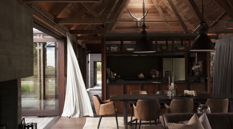 On this award-winning home, the cathedral-like interior has ceiling, interior design, living room, wood, brown, black