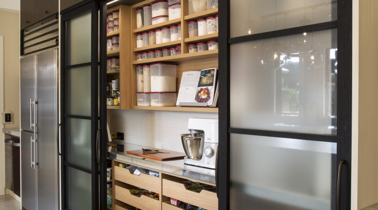 The pantry door frames and large flagstone-like floor cabinetry, display case, furniture, interior design, shelving, gray, brown, black