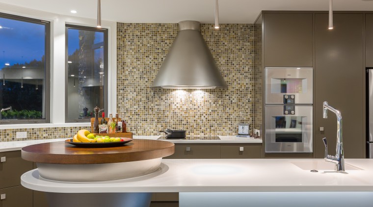 This island includes an under-lit countertop for dramatic architecture, ceiling, countertop, home, interior design, kitchen, room, sink, gray