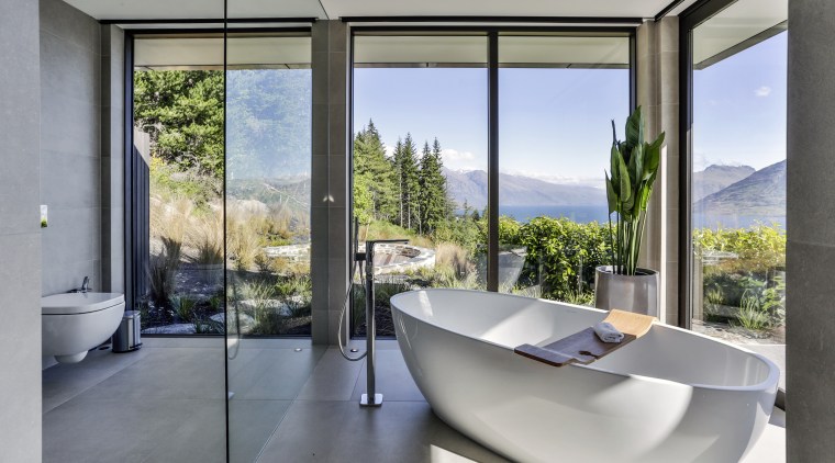 This sculptural tub sits in its own glass architecture, house, interior design, real estate, window, gray