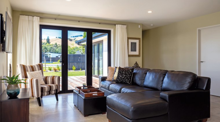The New Zealand lifestyle is all about indoor-outdoor ceiling, home, interior design, living room, property, real estate, room, window, gray