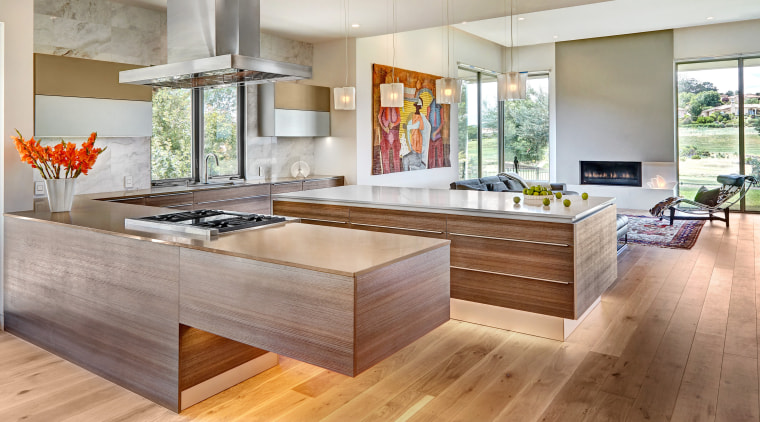 Flooded with natural light that sets off the cabinetry, countertop, cuisine classique, floor, flooring, hardwood, interior design, kitchen, laminate flooring, living room, real estate, wood, wood flooring, gray