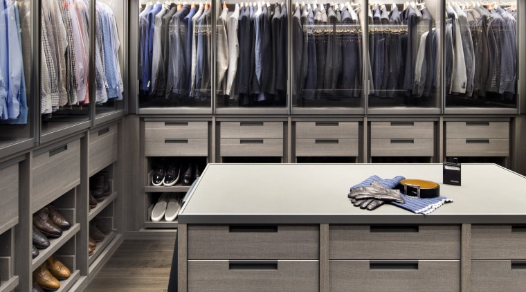 This walk-in wardrobe, and a seasonal closet nearby, closet, countertop, kitchen, room, gray, black