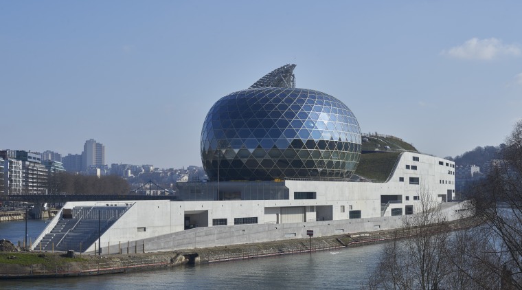 The glass and timber ovoid shape of the architecture, building, city, daytime, reflection, river, sky, water, teal, gray
