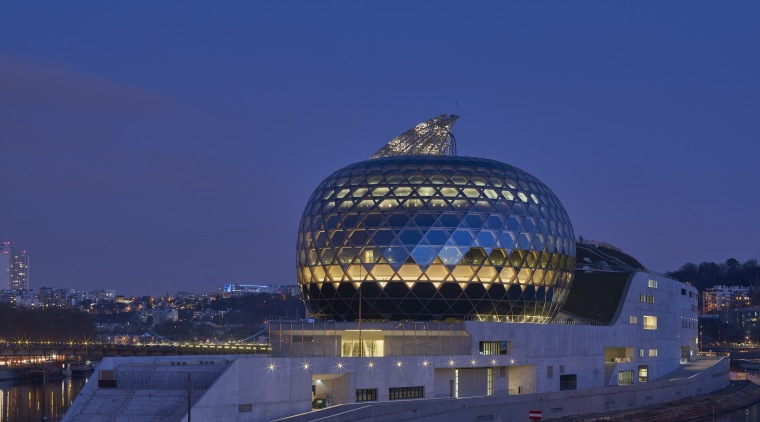 The glass-clad Auditorium is the crowning glory on architecture, building, city, dawn, daytime, dusk, evening, horizon, landmark, night, reflection, river, sky, structure, tourist attraction, water, water resources, waterway, blue