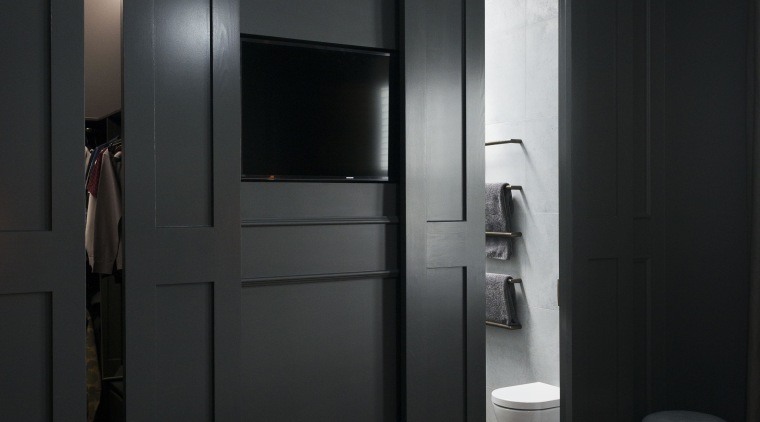 In this master suite makeover, the bedrooms custom door, furniture, interior design, room, wardrobe, black, gray