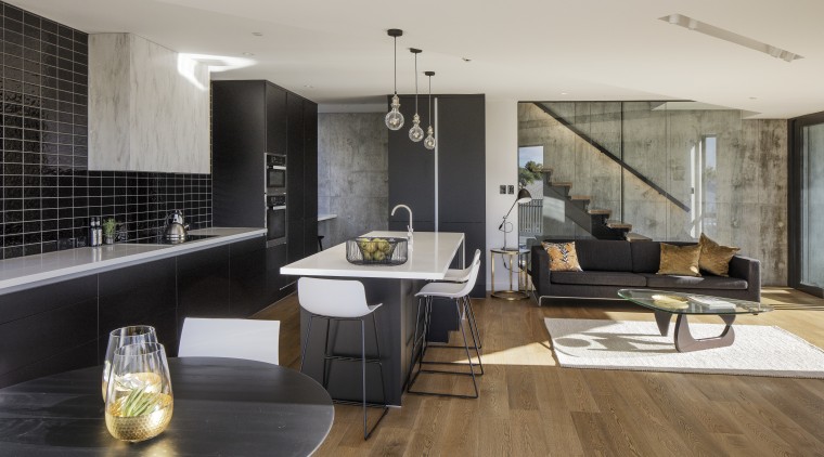On this new kitchen project, the kitchen is architecture, floor, flooring, house, interior design, interior designer, living room, loft, gray, black
