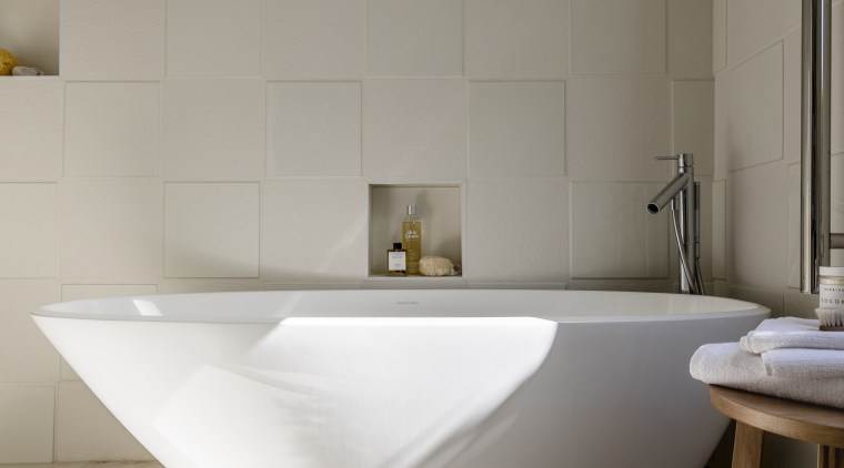 Raised wall tiles are laid in an alternating bathroom, bathroom sink, bidet, ceramic, floor, flooring, interior design, plumbing fixture, product design, sink, tap, tile, wall, gray