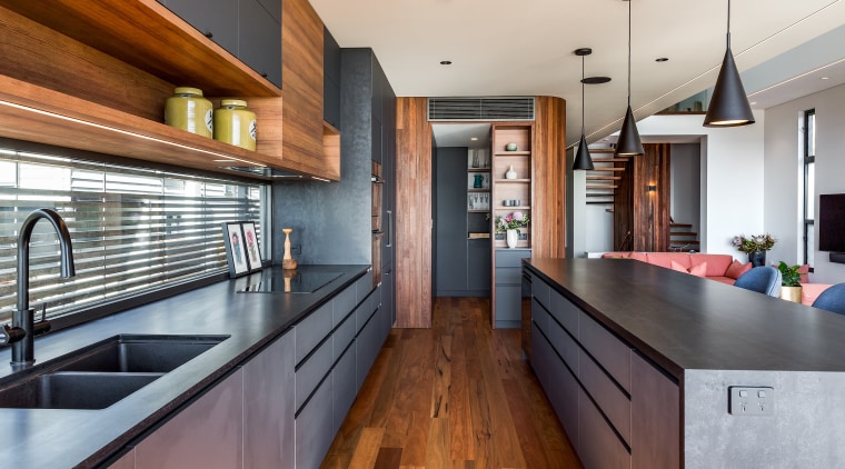 Rich timber-look surfaces work well with the black 