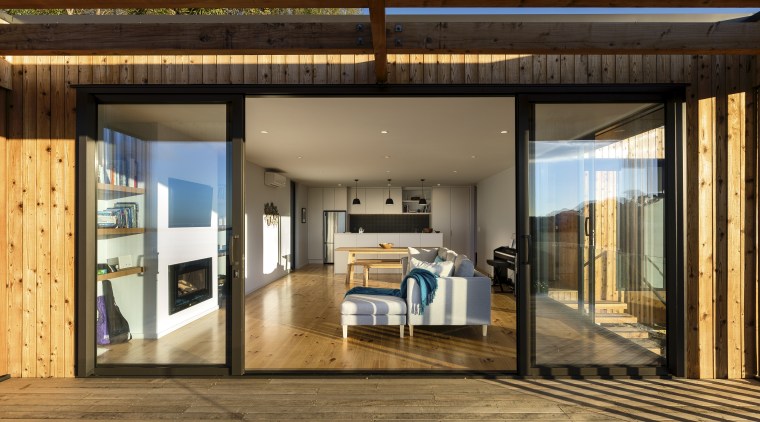 Spatially, the living wing aligns with the north, door, house, interior design, real estate, window, brown