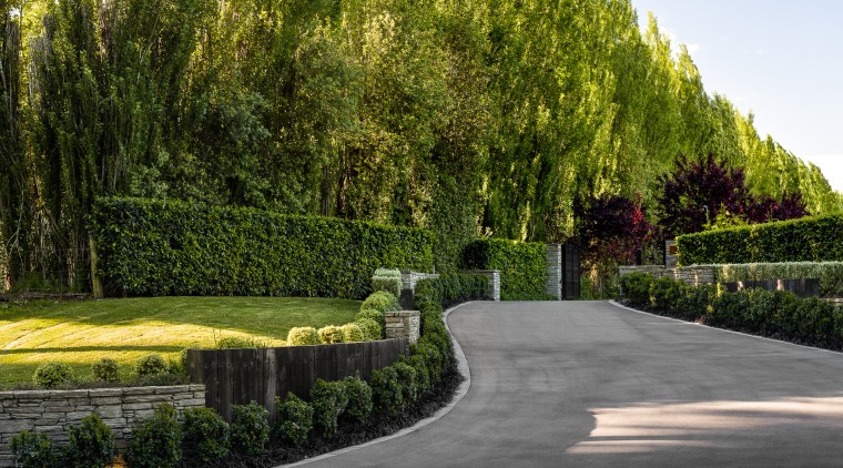 The drive wends its way through the august, 