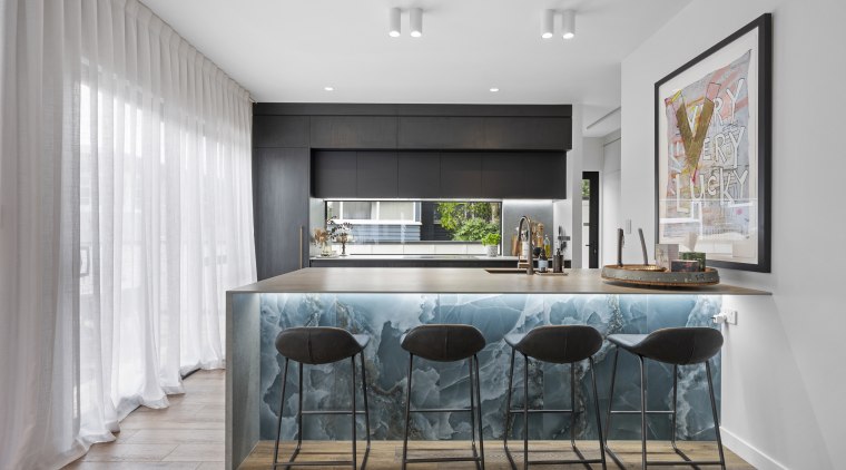 Onyx tiles, lit from under the benchtop, are 