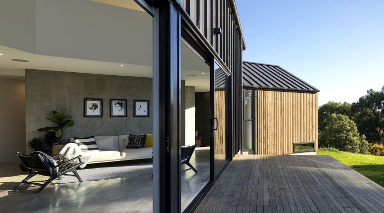 The main ground floor steps gently down the apartment, architecture, building, concrete, courtyard, deck, design, estate, facade, floor, home, house, interior design, property, real estate, residential area, roof, siding, wall, wood, gray, black