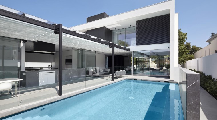 In this home, a swimming pool is positioned architecture, estate, home, house, property, real estate, swimming pool, villa, window, teal