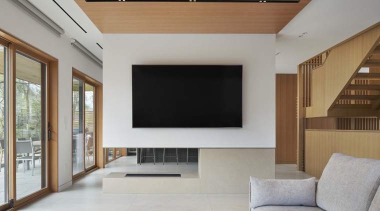 A second limestone-surround fireplace divides lounge and kitchen. 