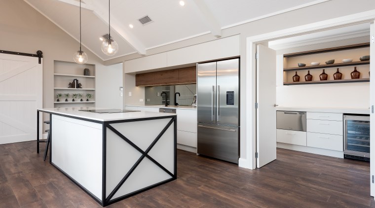 The contemporary kitchen island includes a more rustic 