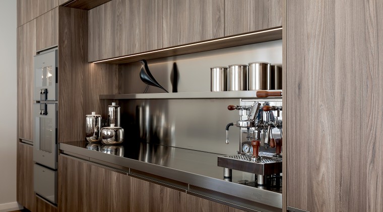 Stainless steel shelving adds to the kitchen's light architecture, building, cabinetry, ceiling, countertop, cupboard, floor, furniture, hardwood, home, house, interior design, kitchen, material property, property, room, shelf, wall, gray, brown